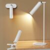 Modern versatile lamps: wall-mounted, table, and clip-on designs for effective task lighting in sleek white finish.