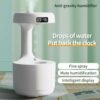 Anti-Gravity Water Drop Humidifier with digital display, fine spray, and mute function for optimal home humidity.