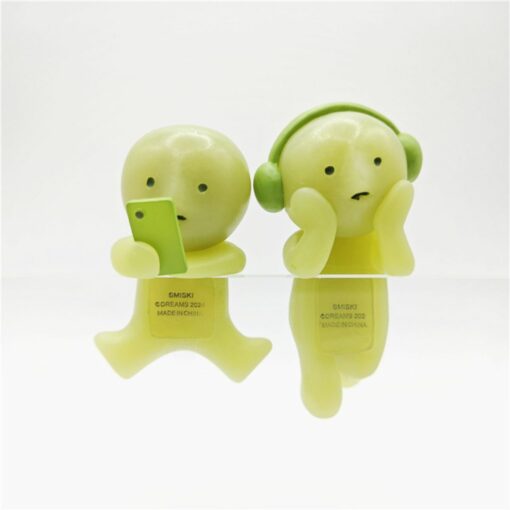 Cute Smiski figures: one with phone, one with headphones. Perfect for collectors seeking quirky decor accents.