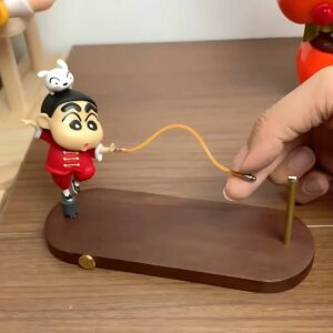 Toy figurine on wooden base with interactive skipping rope, featuring cute character design for desk decor.
